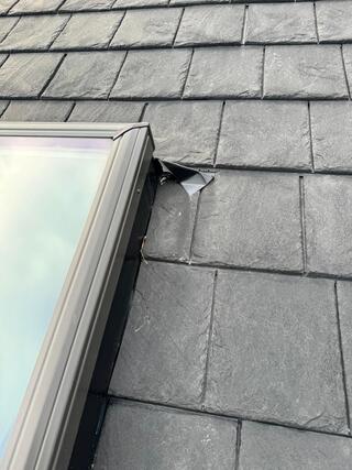 close up view photo of skylight flashing and skylight backpanel integrated into a rubber roof