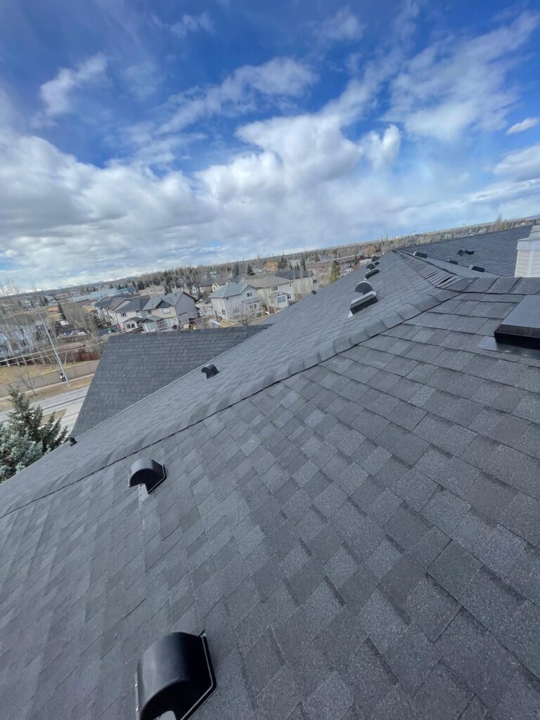 HKS Construction insurance-approved BP shingle re-roof on commercial condo building at Sierras of Evergreen, Calgary