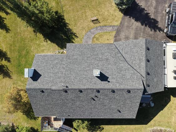 finished asphalt shingle roof upgraded roof ventilation system drone view calgary ab