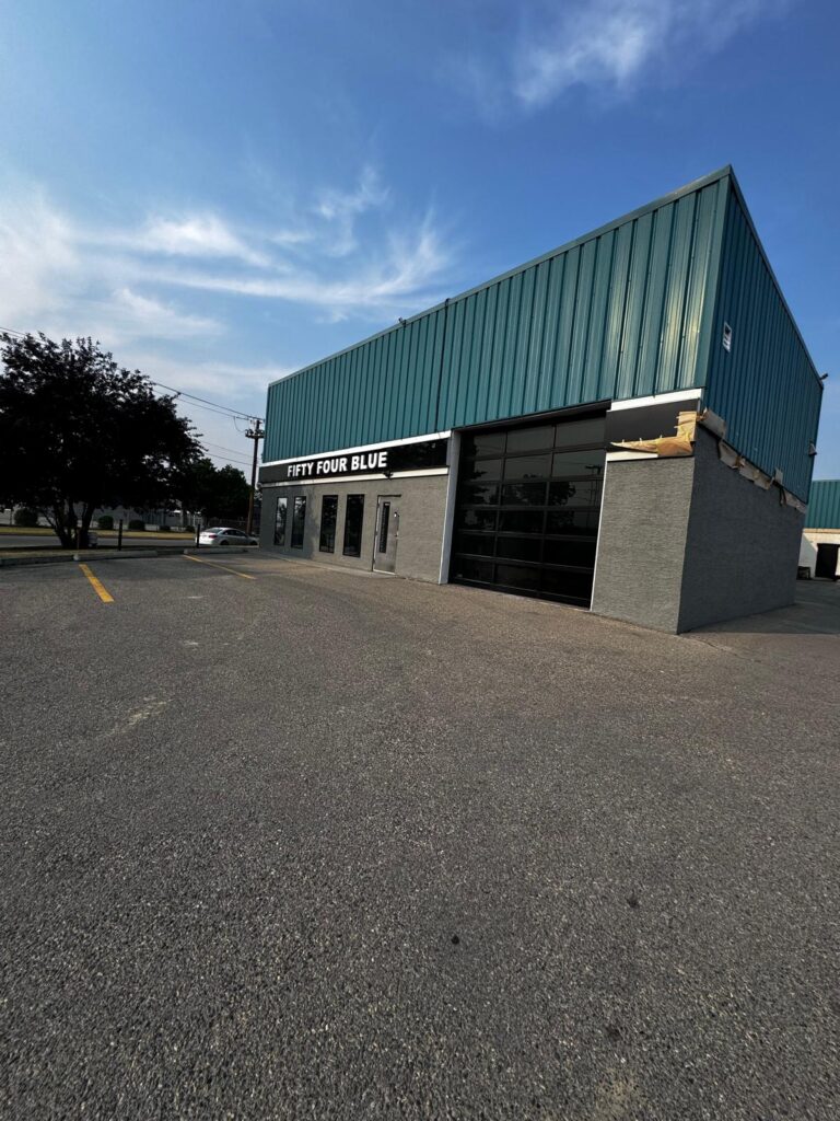 exterior overhaul to Fifty Four Blue building in Calgary. New green roof and stucco imasco siding
