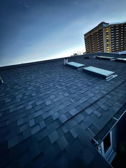 early evening photo of 4 curb mounted skylights installed in calgary ab