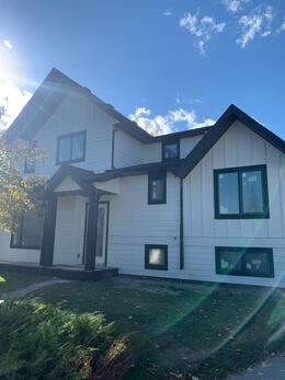 rear view of board and batten installed on a 4 plex on a contract for Rockey Homes. Installation by HKS Construction