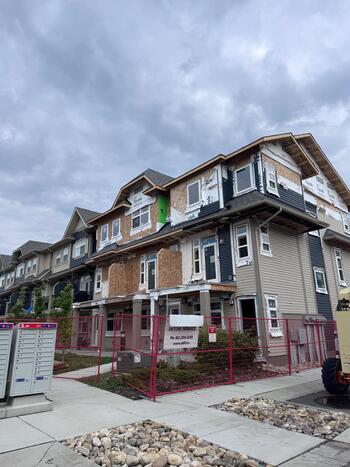 replacing hail damaged vinyl siding to townhouses in NW Calgary post 2024 hail in Calgary